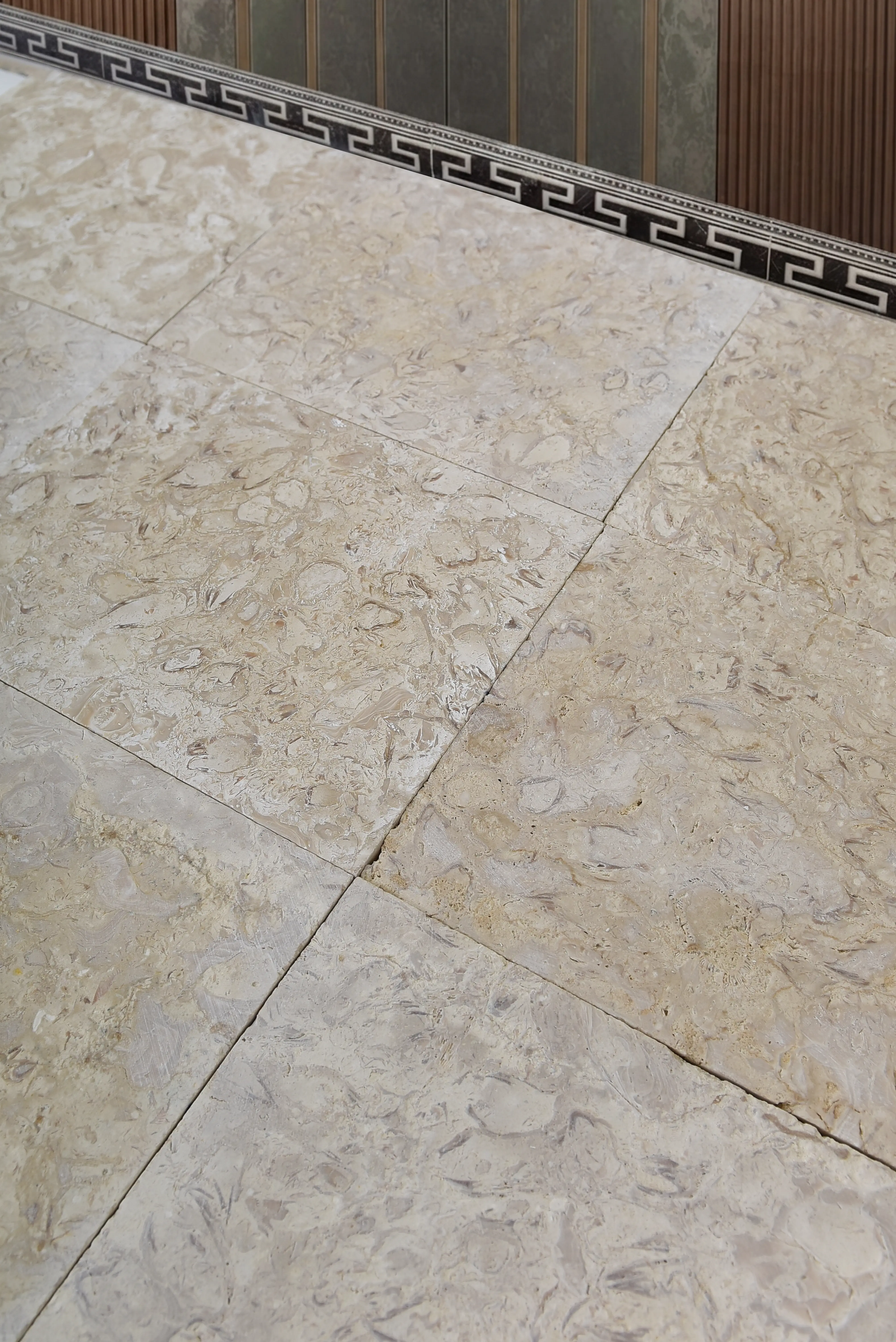 Close-up of elegant granite tile flooring with natural veining patterns, relevant to Granite Suppliers.