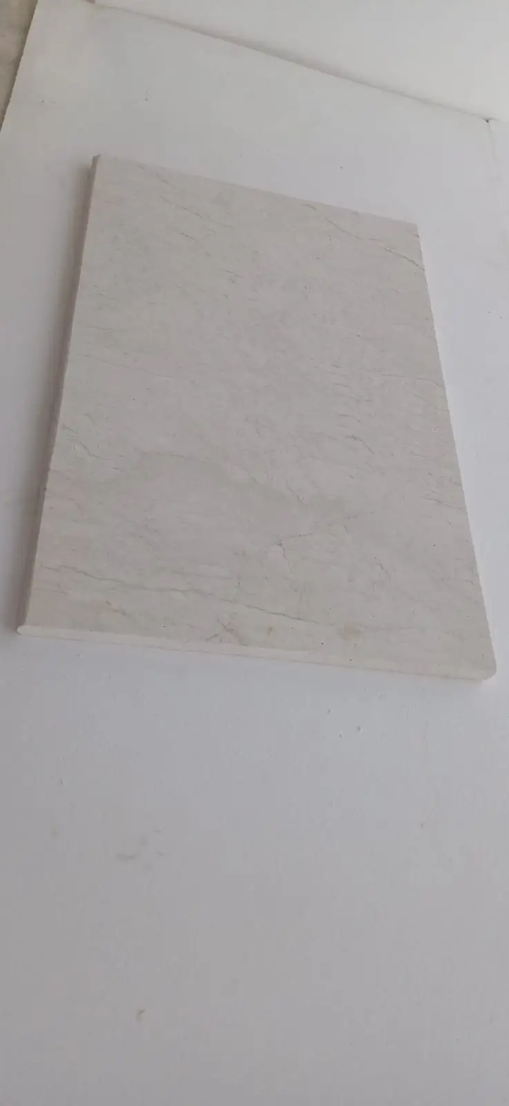 Light-colored marble stone slab with subtle veins and a smooth finish, shown for guide to green marble.