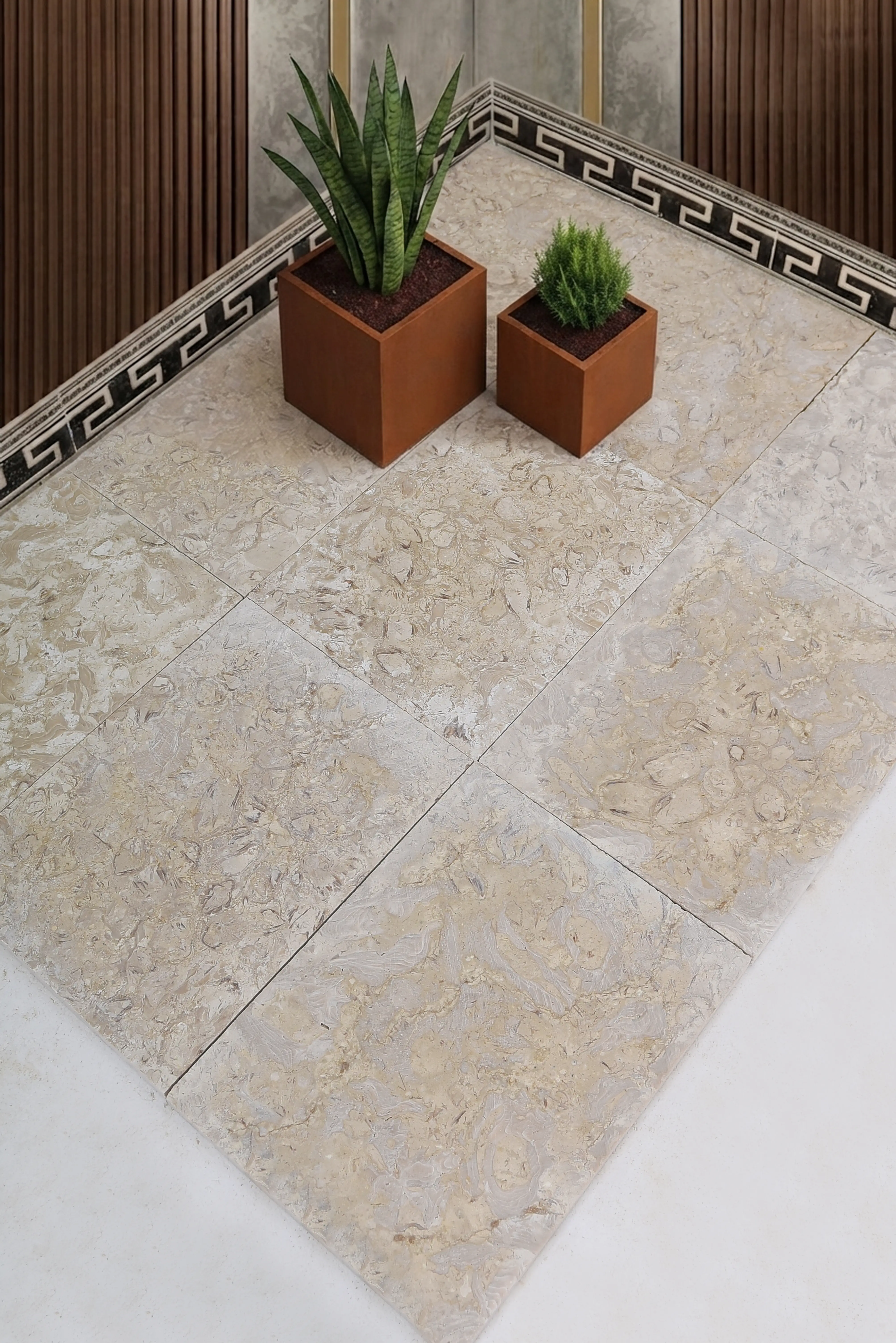 Modern Interior Stone Tile Flooring Close-up of light travertine stone floor tiles with natural veining patterns, pictured for suppliers of granite worktops.