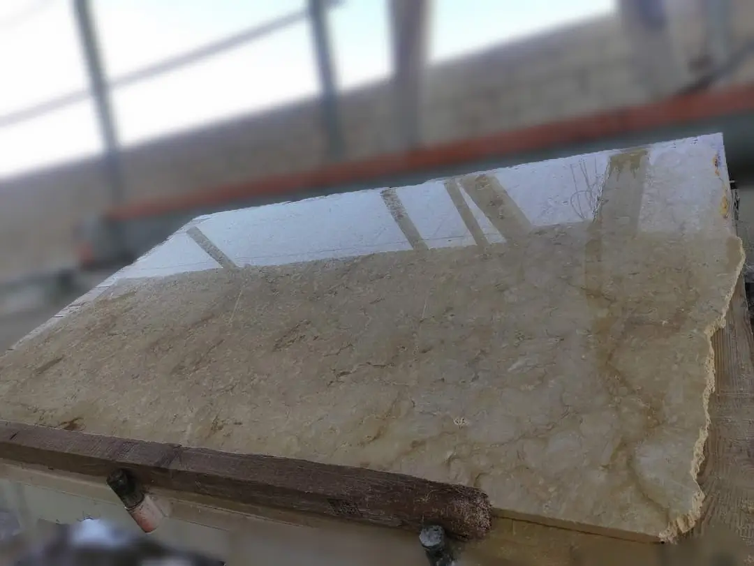 Close-up view of a polished marble slab showing its intricate natural veining and texture, pictured for how to choose masonry stone contractor.