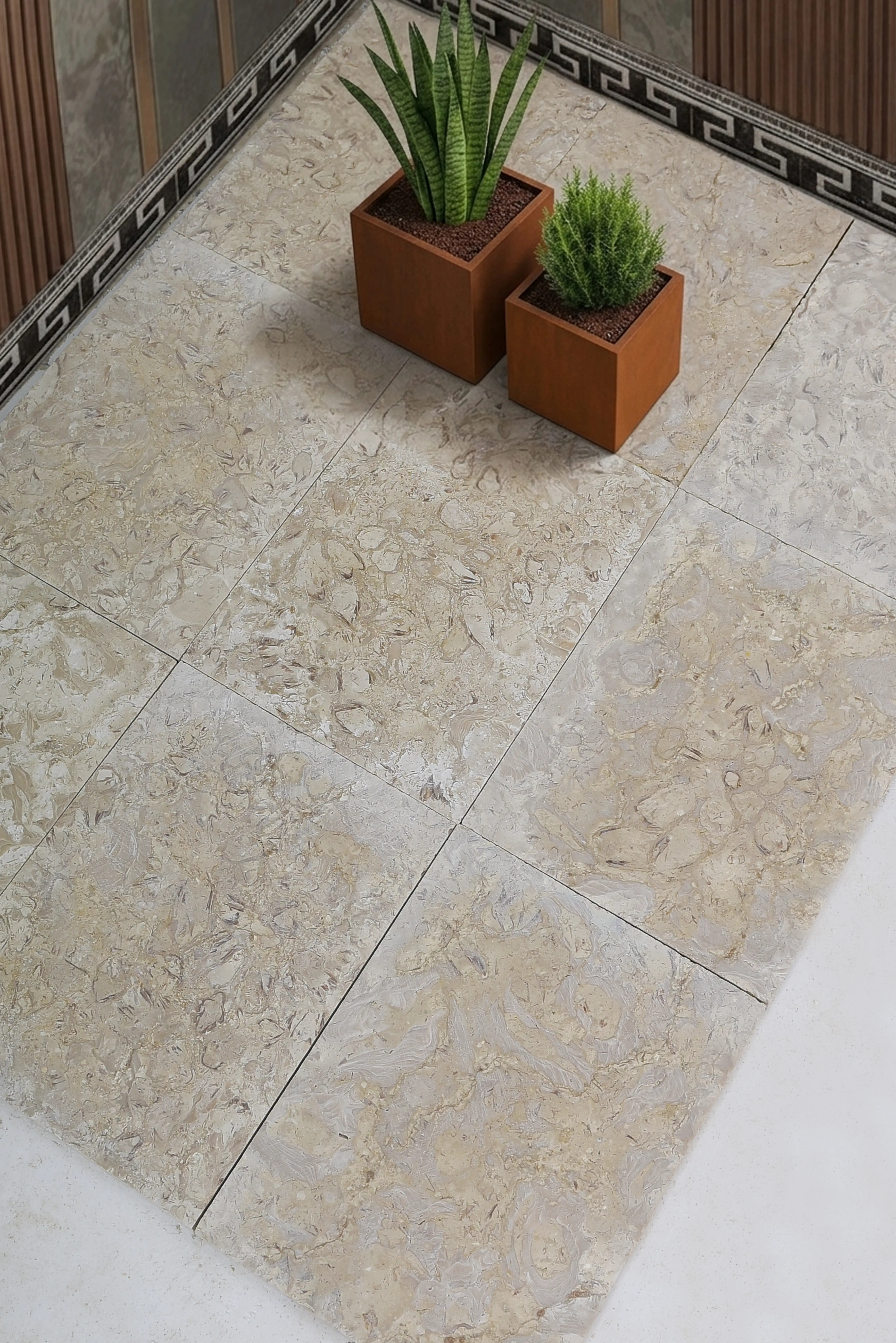 Close-up of light travertine floor tiles with subtle veining and texture, relevant to how to remove granite stains.