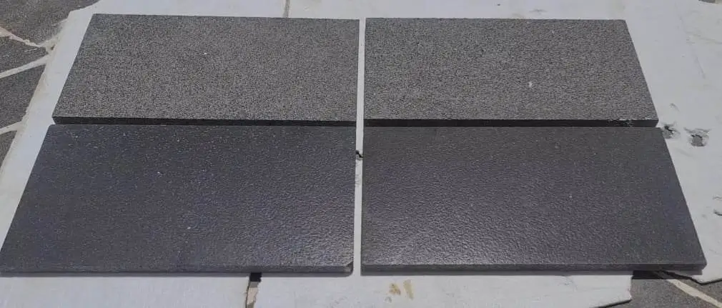 Comparison of two different textured dark limestone pavers for landscaping projects, relevant to portsea grey limestone.