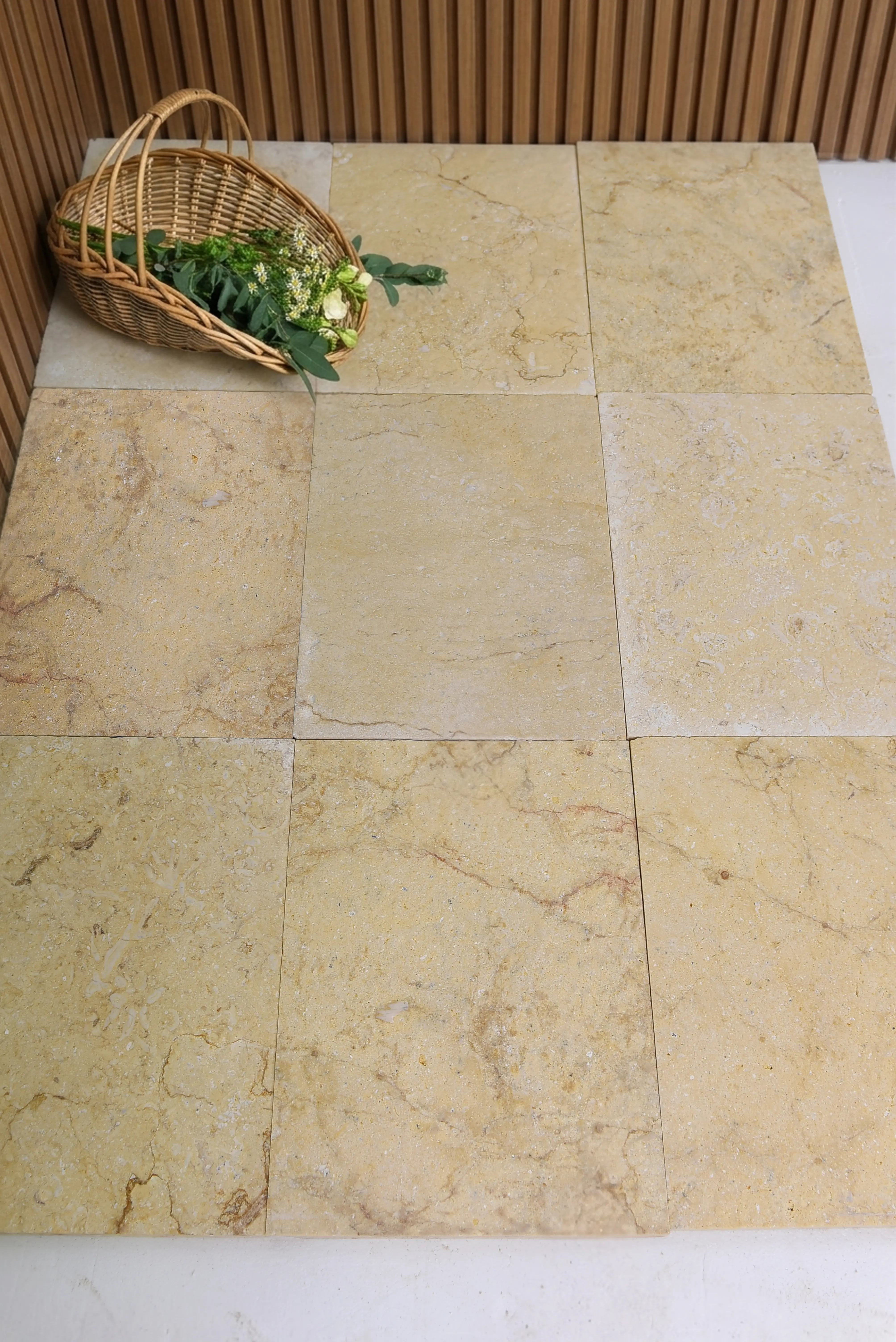 Close-up view of beige marble tiles showing natural veining and subtle texture, pictured for Stone Steps & Treads.