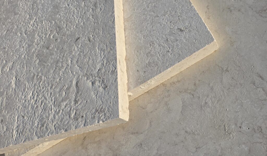 Diagonal sawn edge across 16 grit brushed limestone