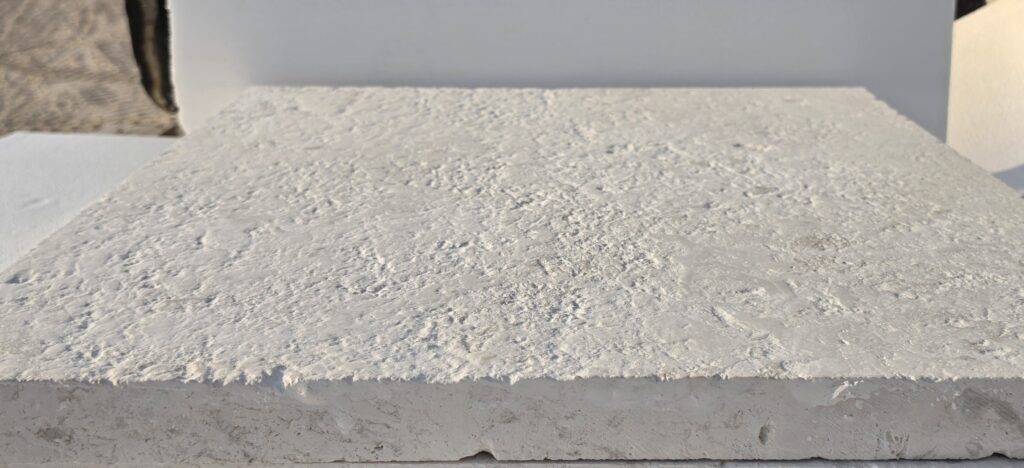 16 grit brushed limestone slab surface receding to the horizon