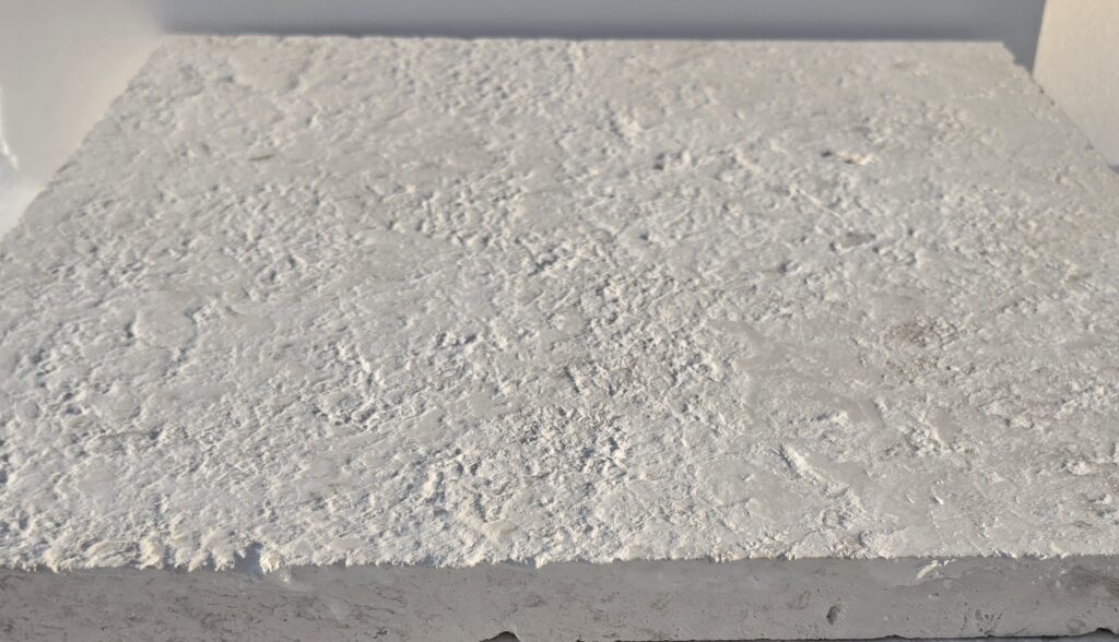 16 grit brushed limestone paver showing full-body thickness