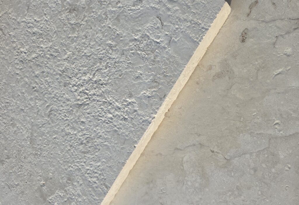Sawn edge diagonal across 36 grit brushed limestone