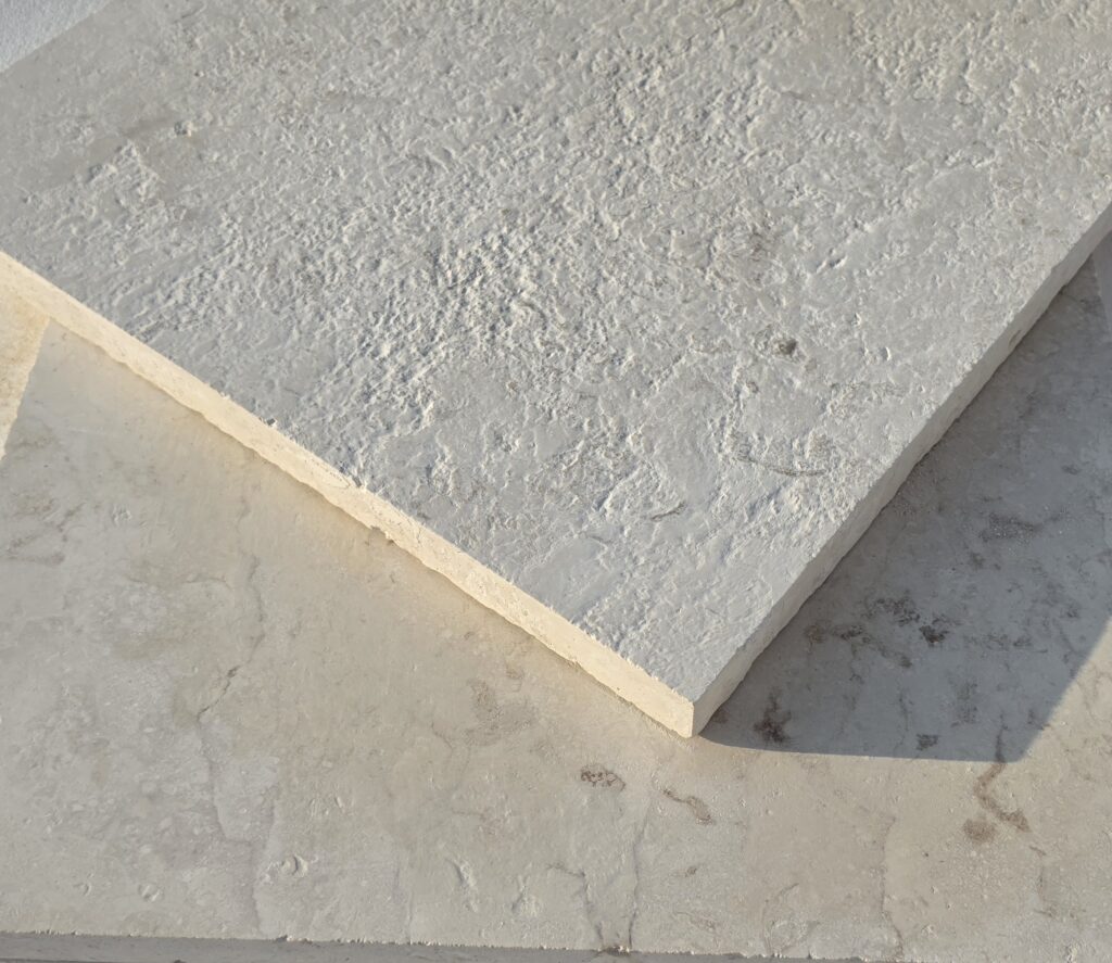 Stacked 36 grit brushed antiqued limestone slabs