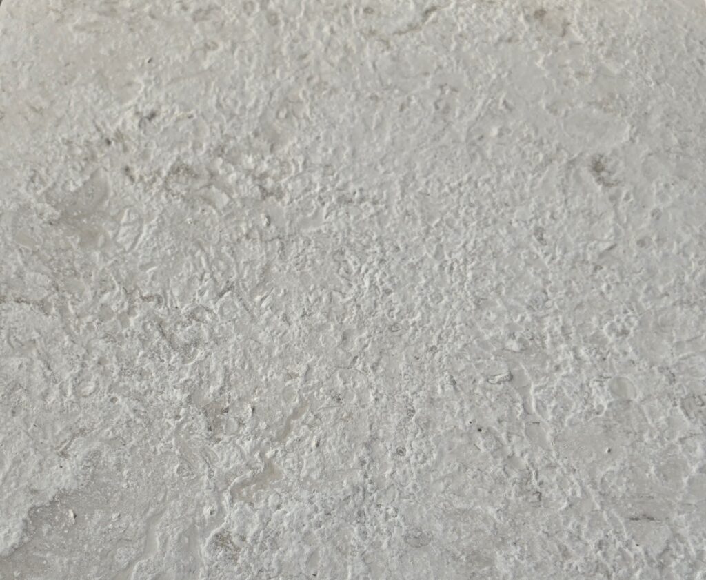 Fine 80 grit brushed antiqued limestone detail