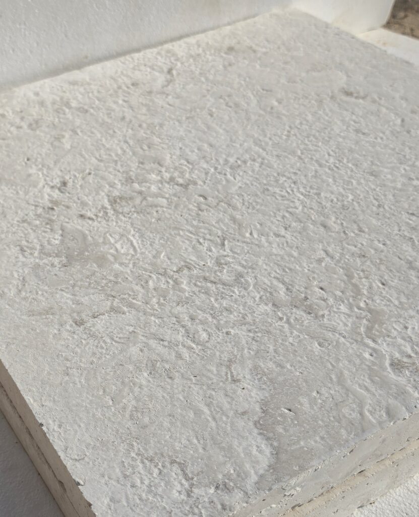 Edge detail on 80 grit brushed limestone
