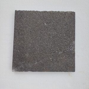 Bush-hammered black basalt tile