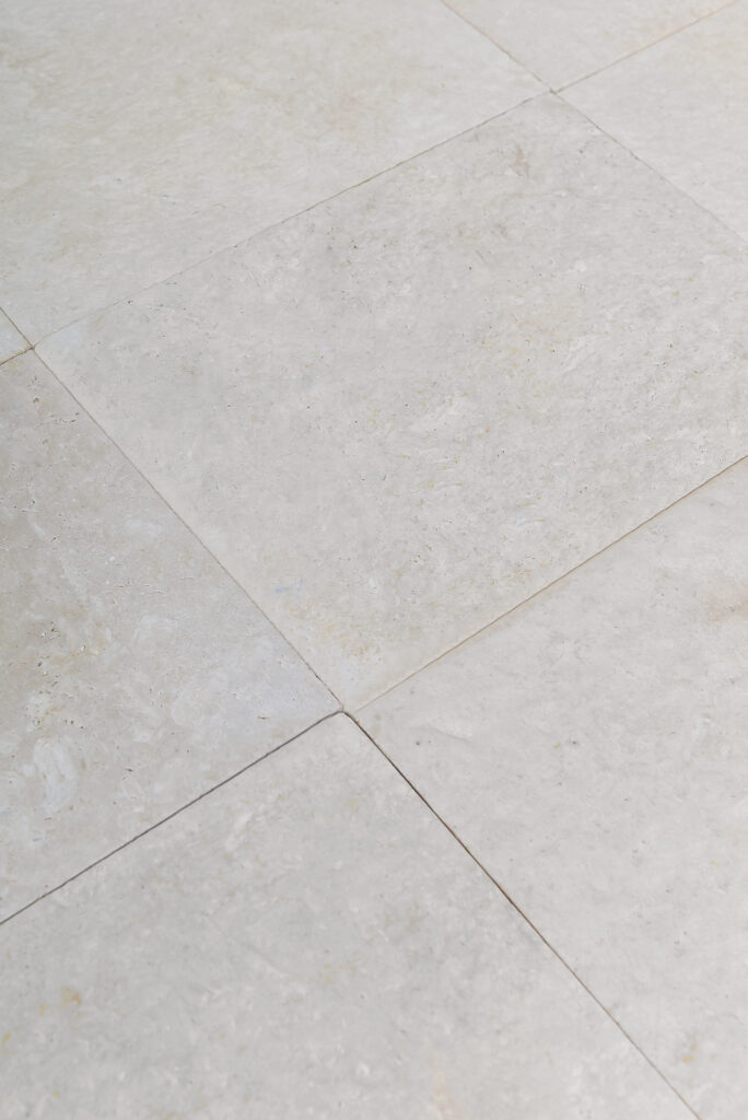 Double-brushed 24 grit limestone tiles laid on the diagonal
