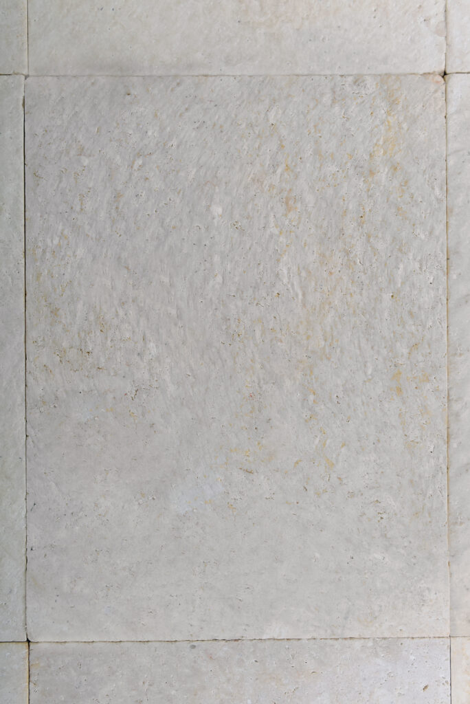 Deep rounded texture of double-brushed 24 grit limestone, top-down view