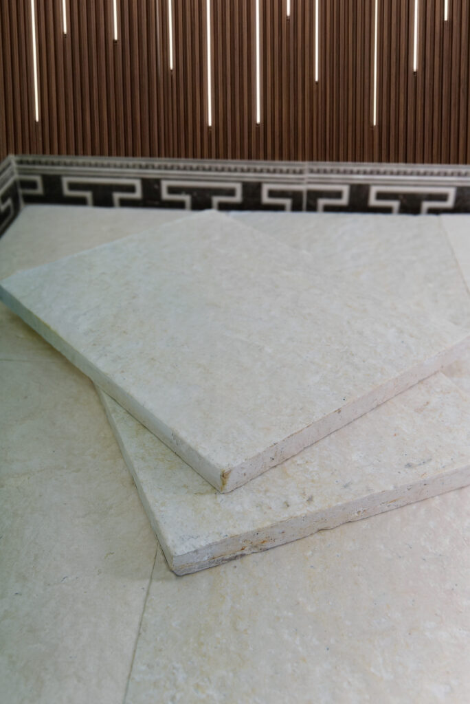 Double-brushed 60 grit limestone tiles laid as flooring
