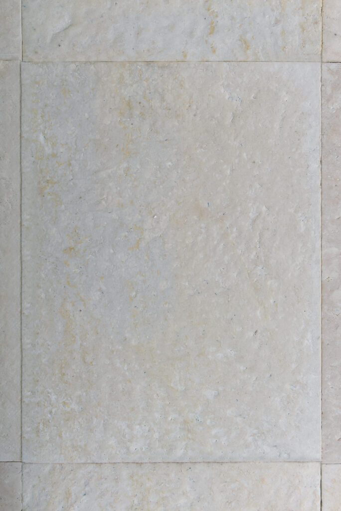 Soft rounded texture of double-brushed 60 grit limestone, top-down view