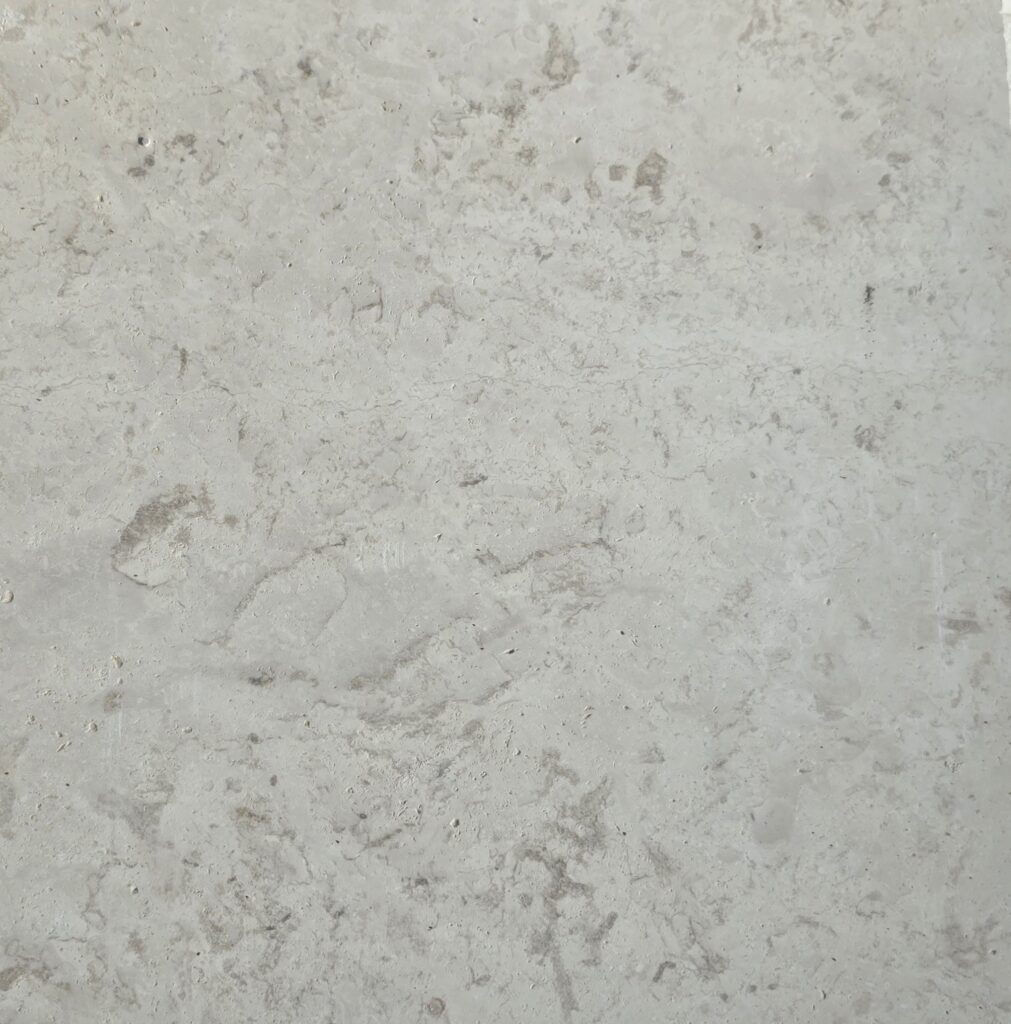 Natural fossil clouding on 60 grit honed limestone