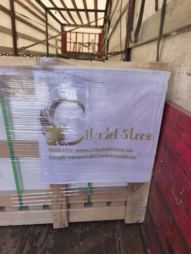 White limestone pavers packed in wooden crates with Citadelstone logo