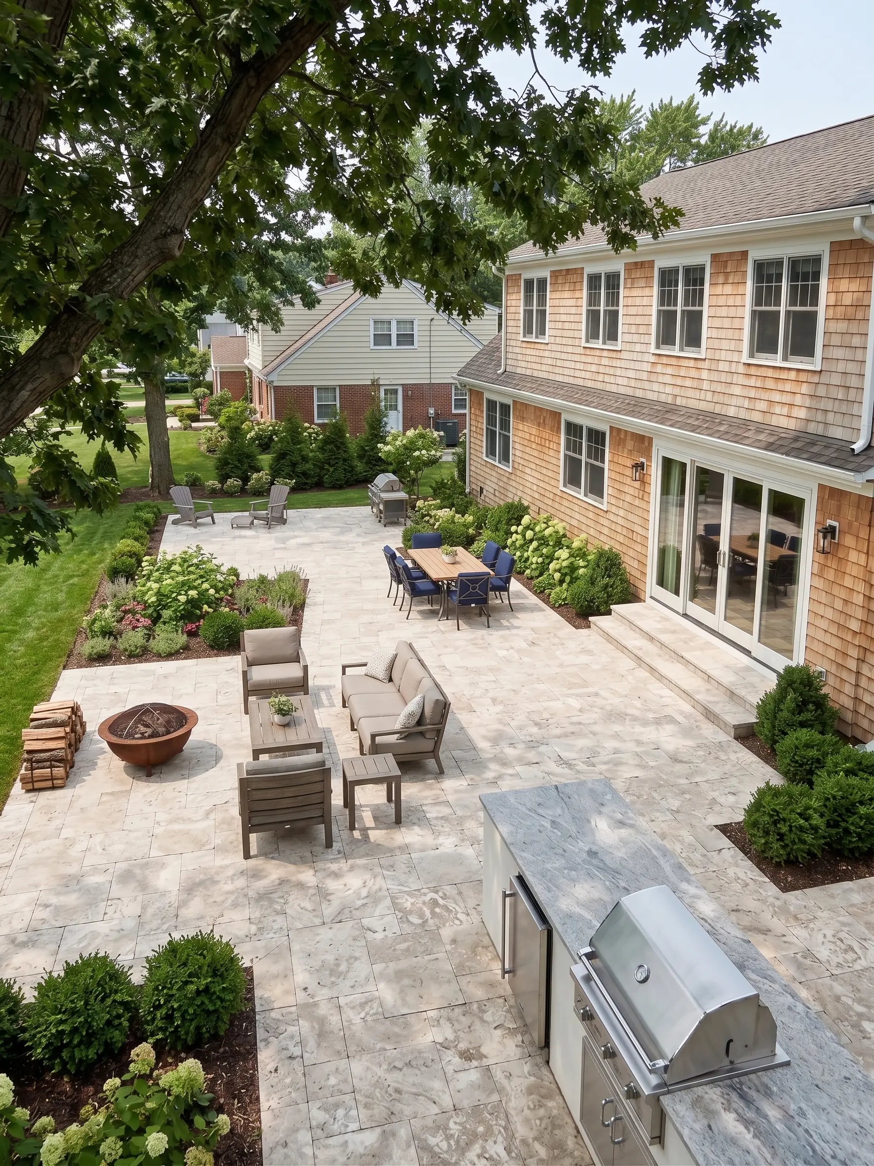 Outdoor living space with stone patio Marble pavers create a beautiful outdoor living space with seating and a grill
