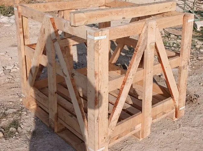 Empty heavy-duty wooden crate frame with diagonal bracing.