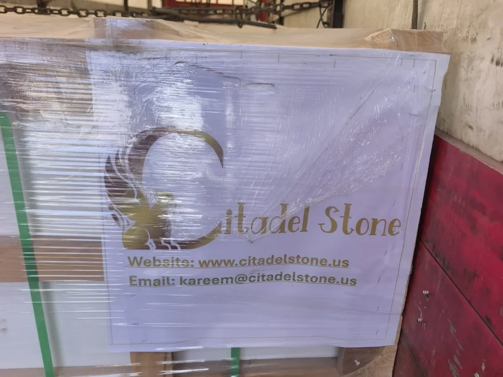 Film-wrapped wooden crate with a Citadel Stone label showing the website and email address.
